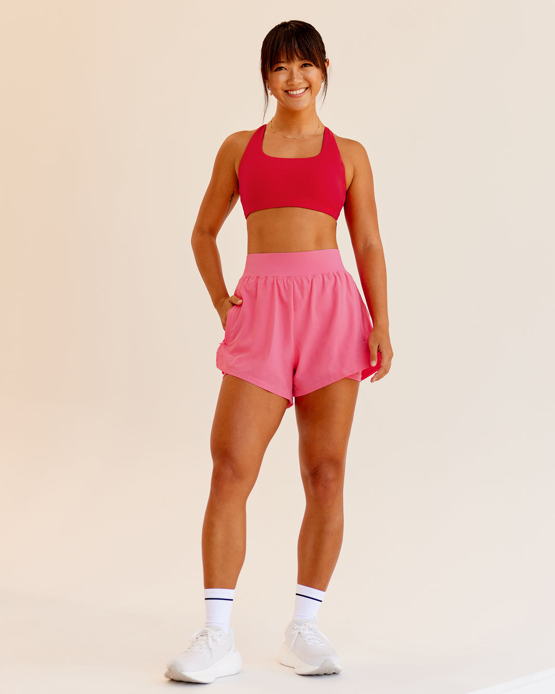 Woman wearing Challenger 3&quot; Lined Performance Shorts in Pink Lemonade | Size:S