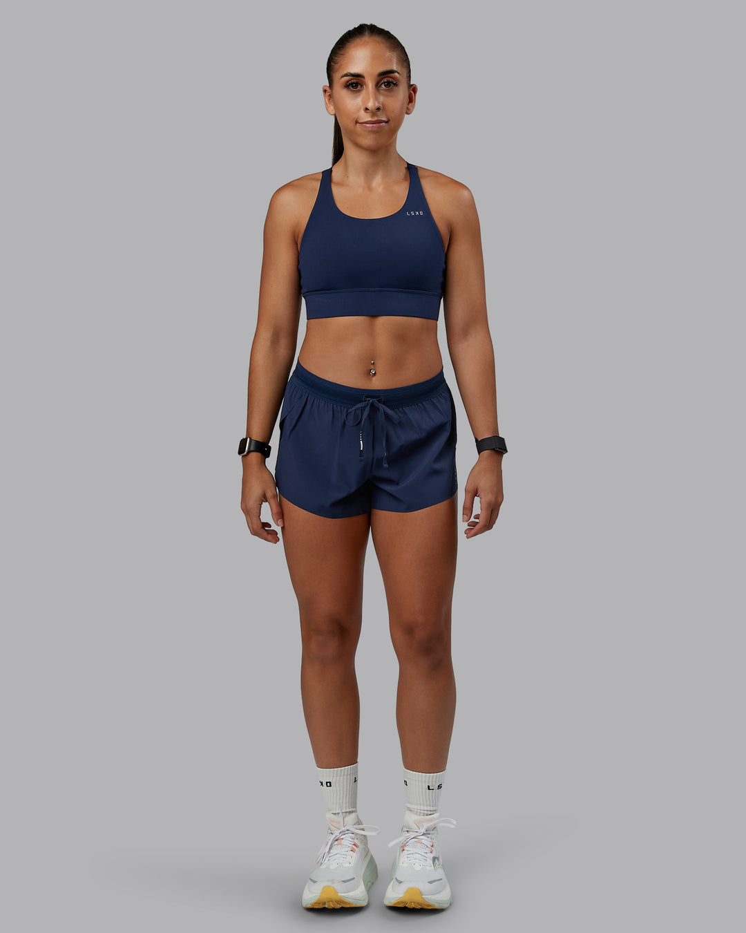 Woman wearing Accelerate Run Short 3&quot; in Future Navy | Size:S