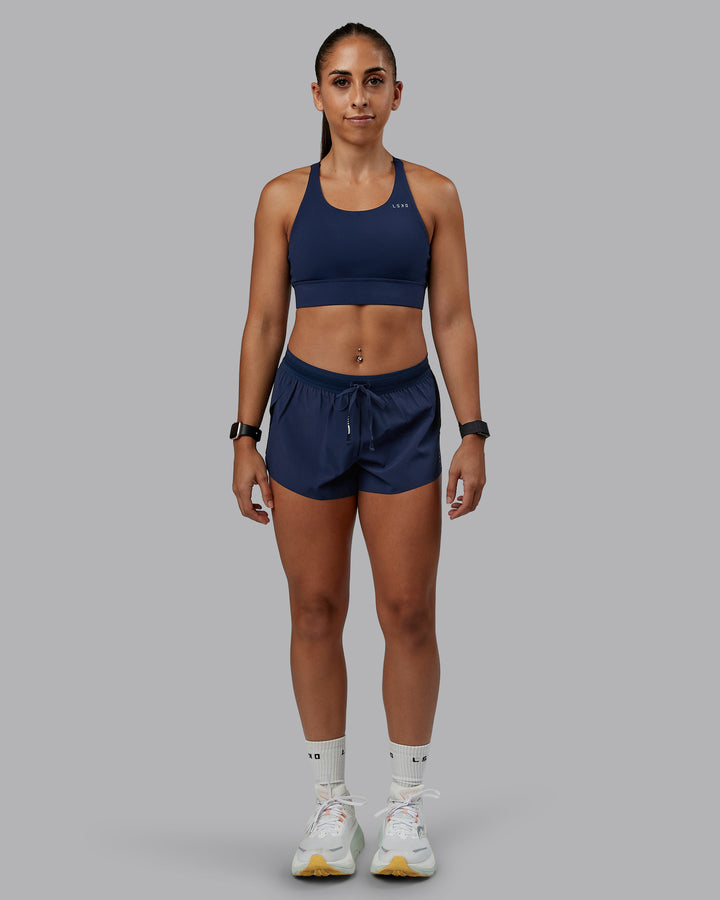 Woman wearing Accelerate Run Short 3&quot; in Future Navy | Size:S
