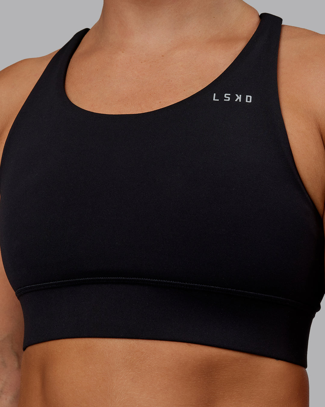 Woman wearing Accelerate Sports Bra in Black | Size:S