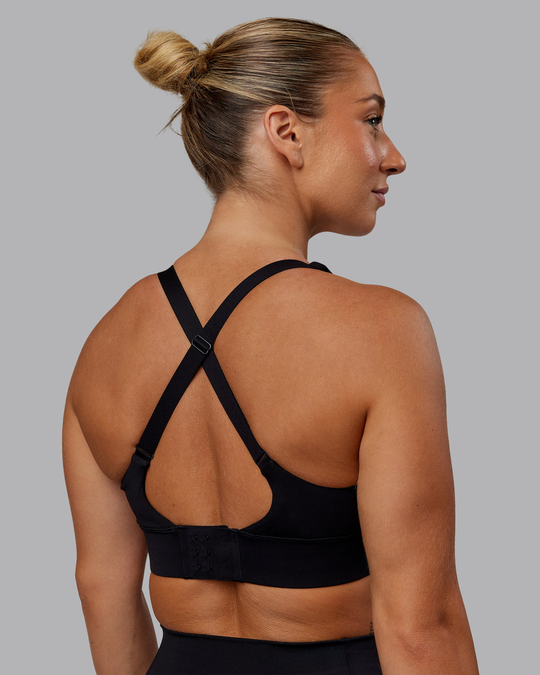 Woman wearing Accelerate Sports Bra in Black | Size:S