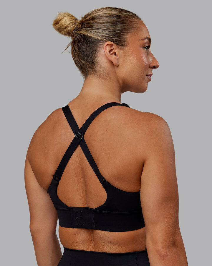 Woman wearing Accelerate Sports Bra in Black | Size:S
