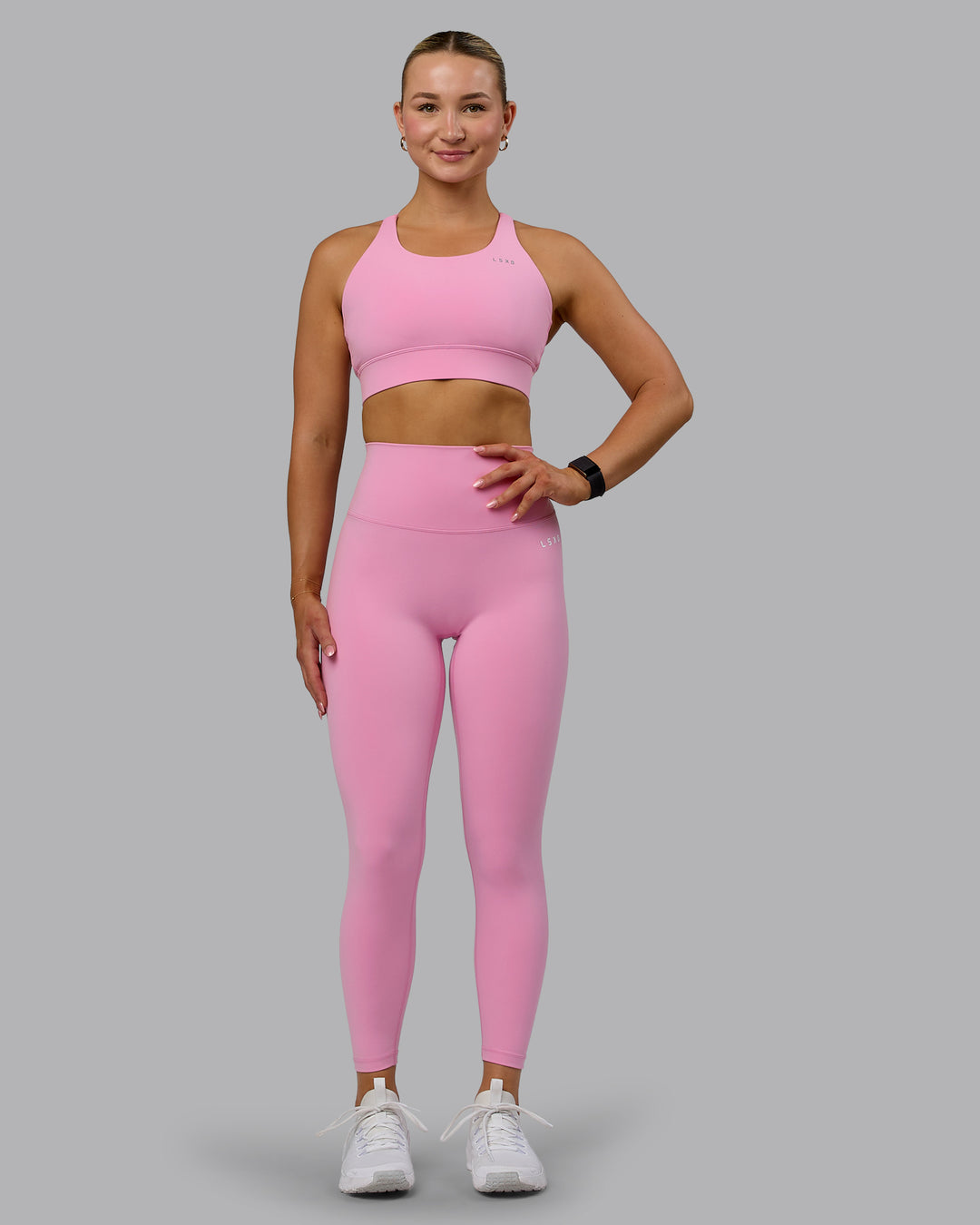 Woman wearing Accelerate Sports Bra - Bubblegum