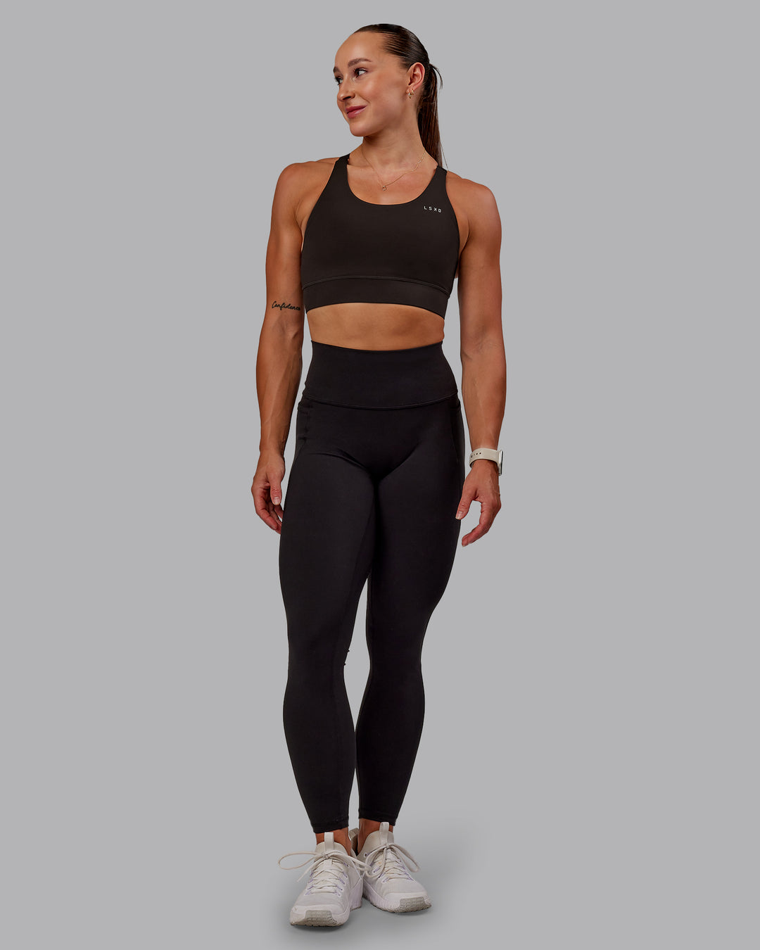 Woman wearing Accelerate Sports Bra in Dark Walnut | Size:S