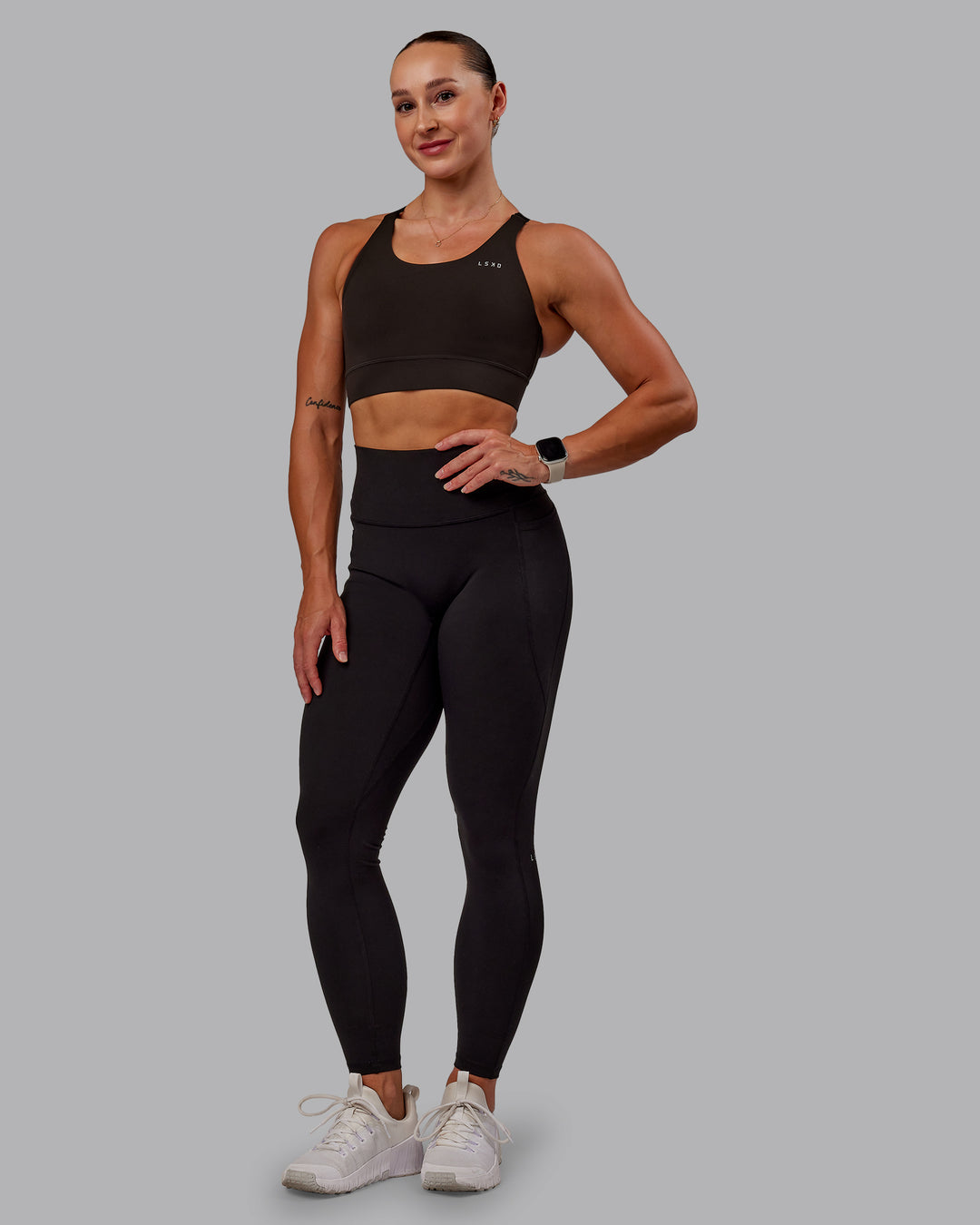 Woman wearing Accelerate Sports Bra in Dark Walnut | Size:S