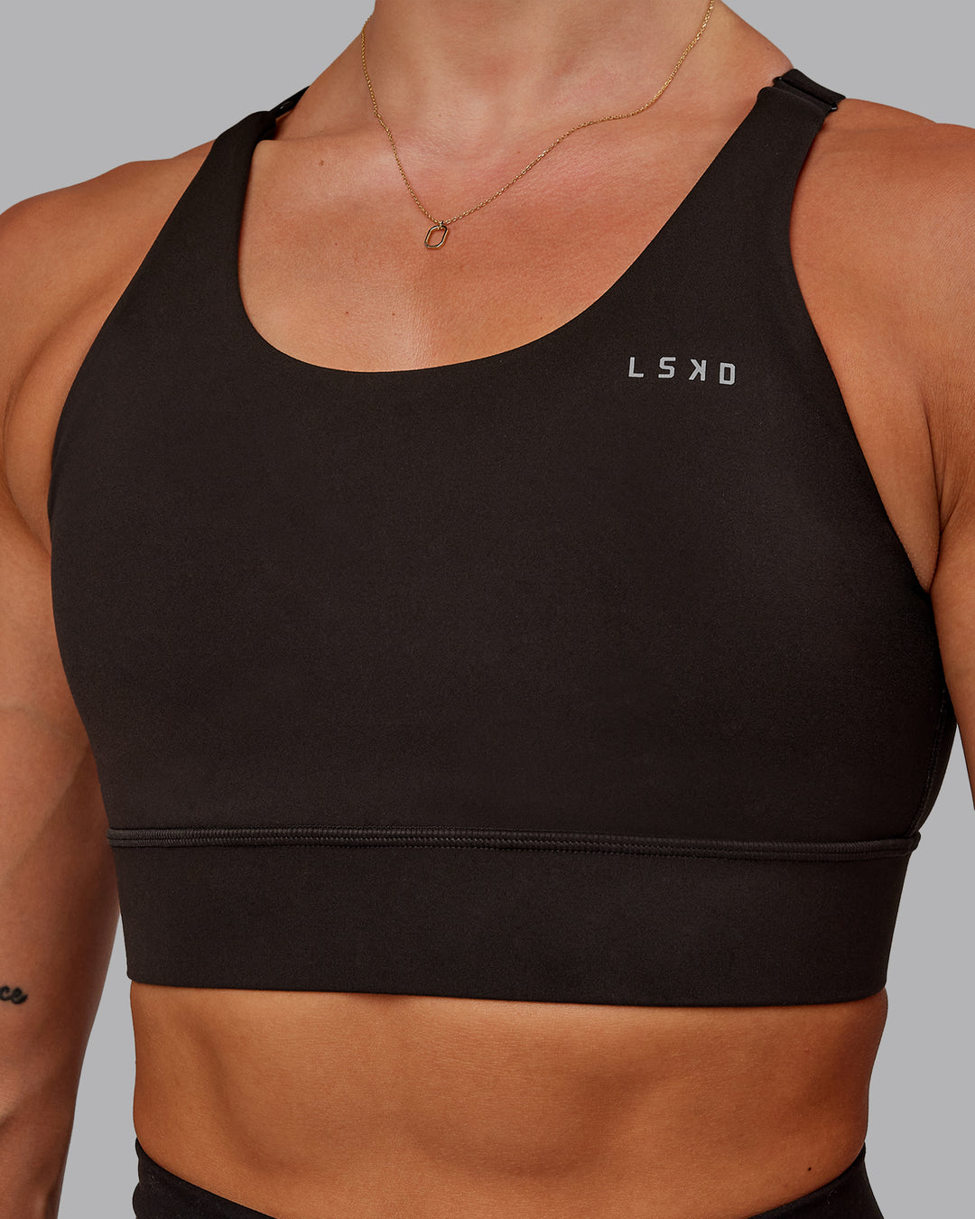 Woman wearing Accelerate Sports Bra in Dark Walnut | Size:S