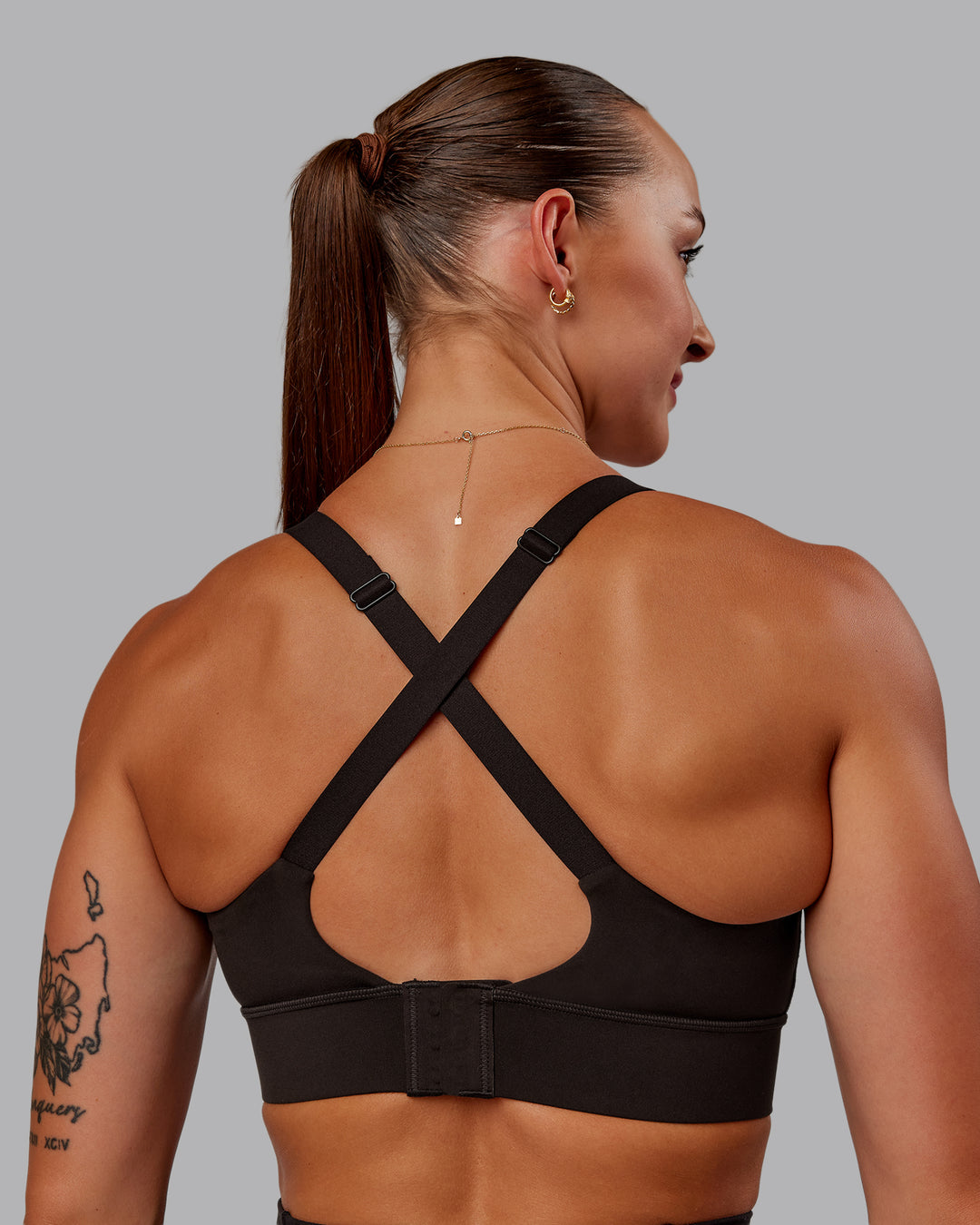 Woman wearing Accelerate Sports Bra in Dark Walnut | Size:S