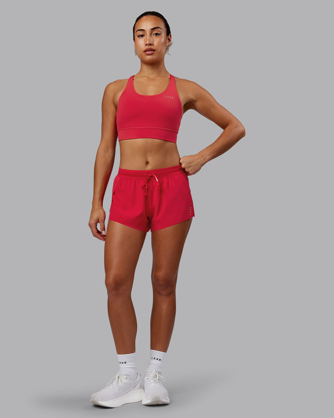 Woman wearing Accelerate Sports Bra - Scarlet