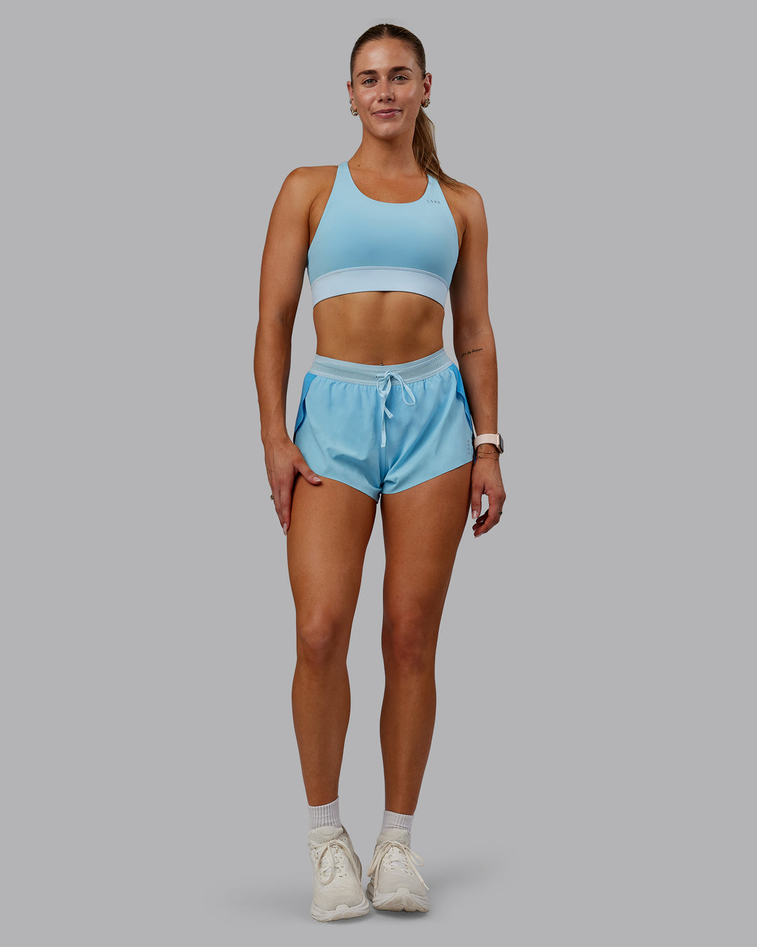 Woman wearing Accelerate Sports Bra - Sky Blue Colourblock