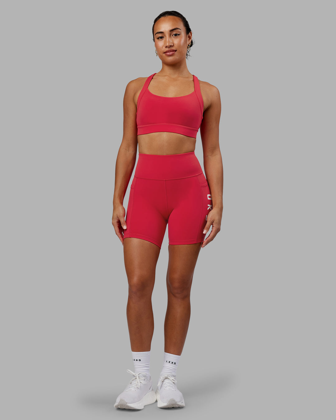 Woman wearing Advance Sports Bra - Scarlet