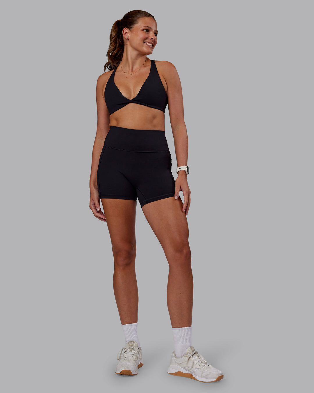 Woman wearing Agile Sports Bra - Black| Model:Phoebe | Size:S