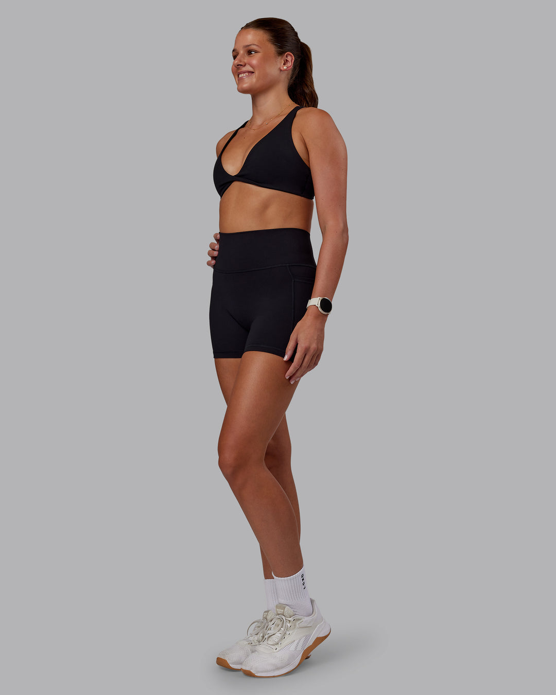 Woman wearing Agile Sports Bra - Black| Model:Phoebe | Size:S