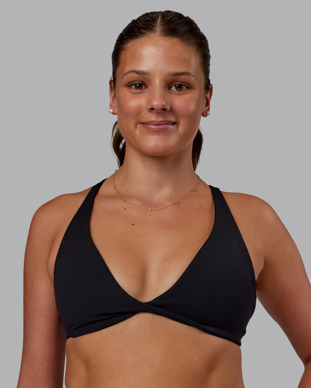 Woman wearing Agile Sports Bra - Black| Model:Phoebe | Size:S