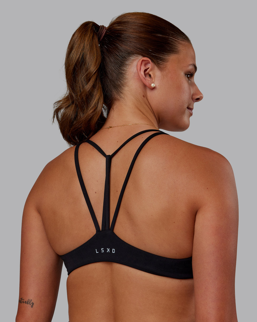 Woman wearing Agile Sports Bra - Black| Model:Phoebe | Size:S