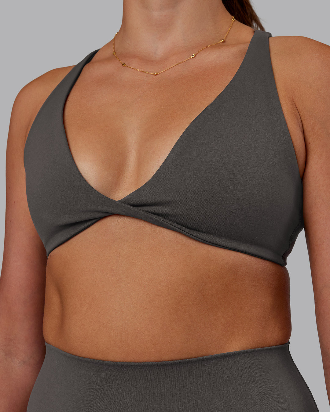 Woman wearing Agile Sports Bra - Dark Storm | Model:Phoebe | Size:S