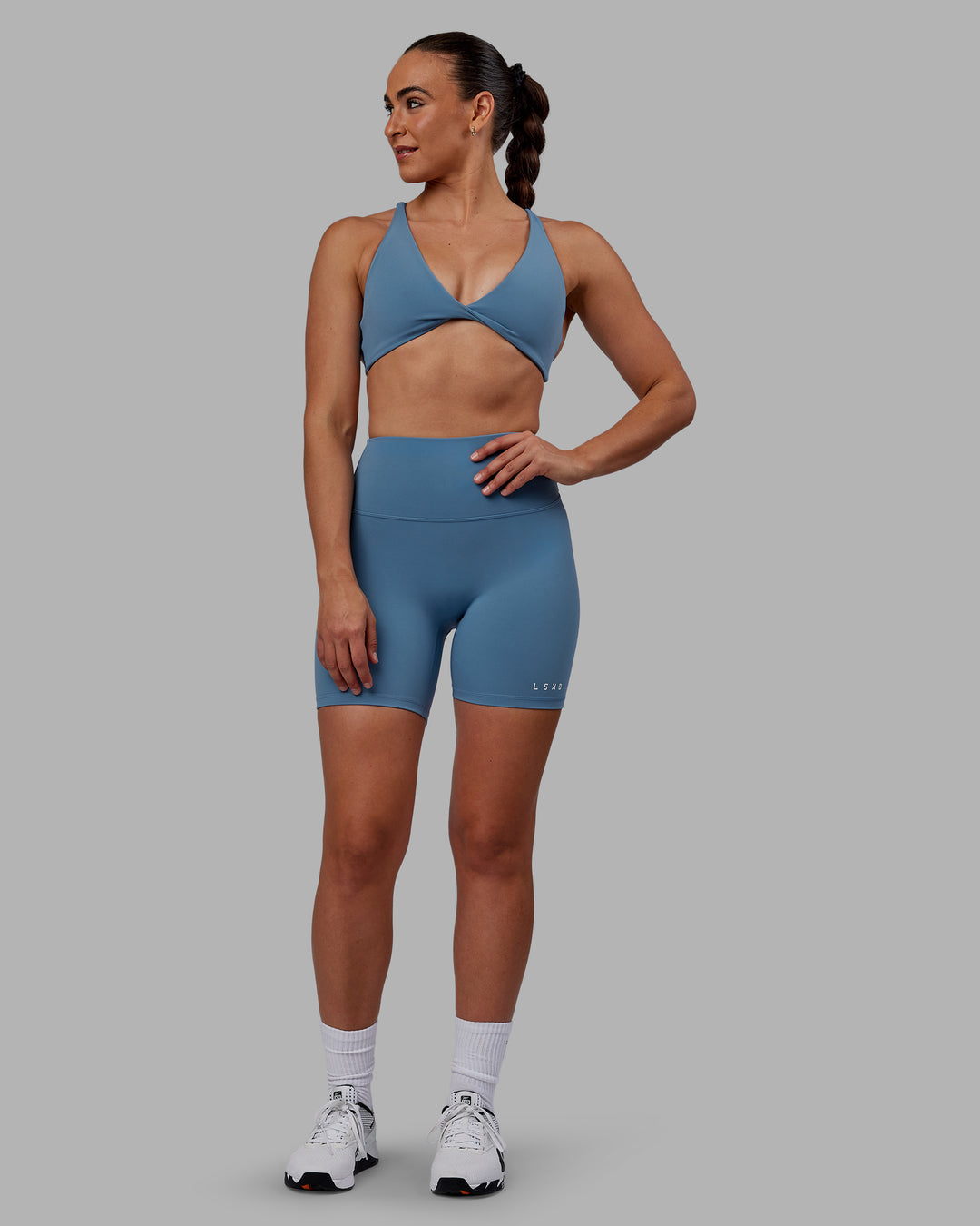 Woman wearing Agile Sports Bra - Elemental Blue