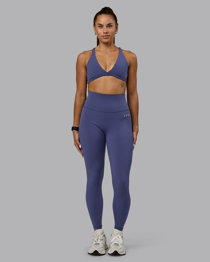 Woman wearing Agile Sports Bra - Future Dusk
