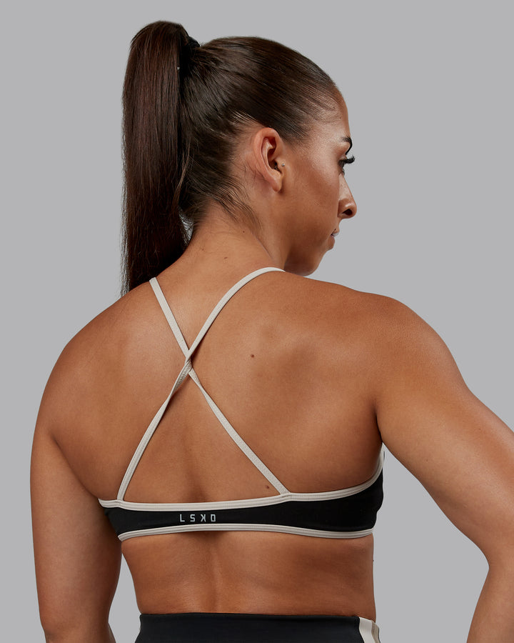 Woman wearing Ambience Sports Bra - Black-Multi | Model:Tylah | Size:S
