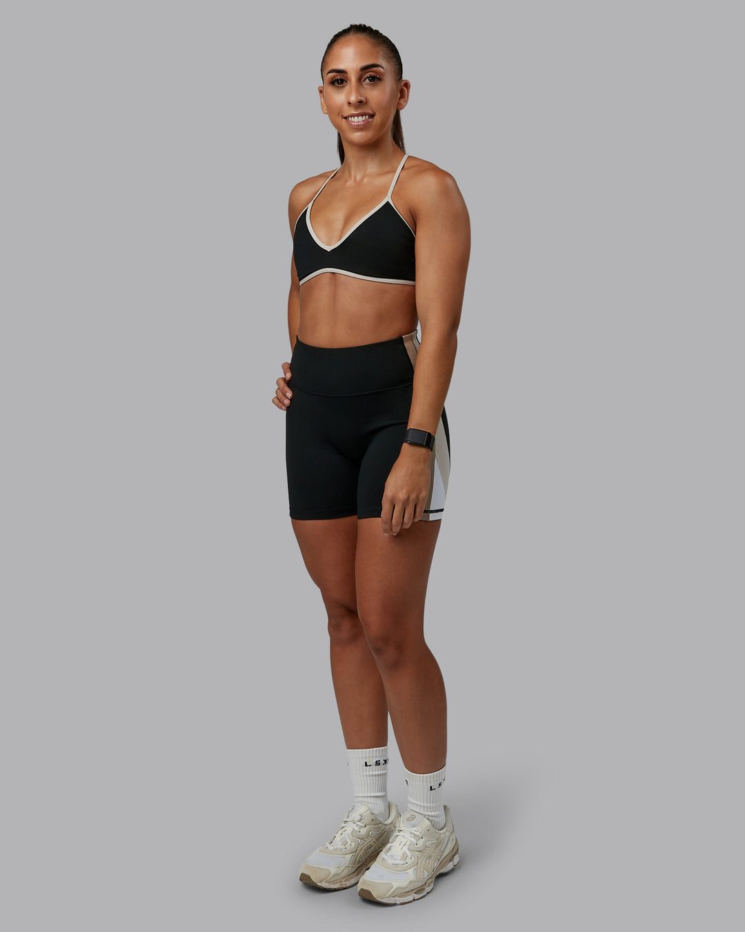 Woman wearing Ambience Sports Bra - Black-Multi | Model:Tylah | Size:S