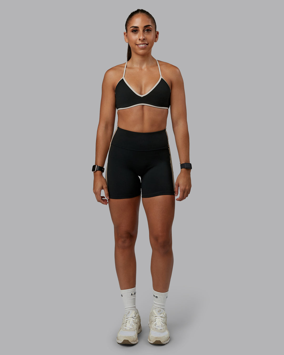 Woman wearing Ambience Sports Bra - Black-Multi | Model:Tylah | Size:S