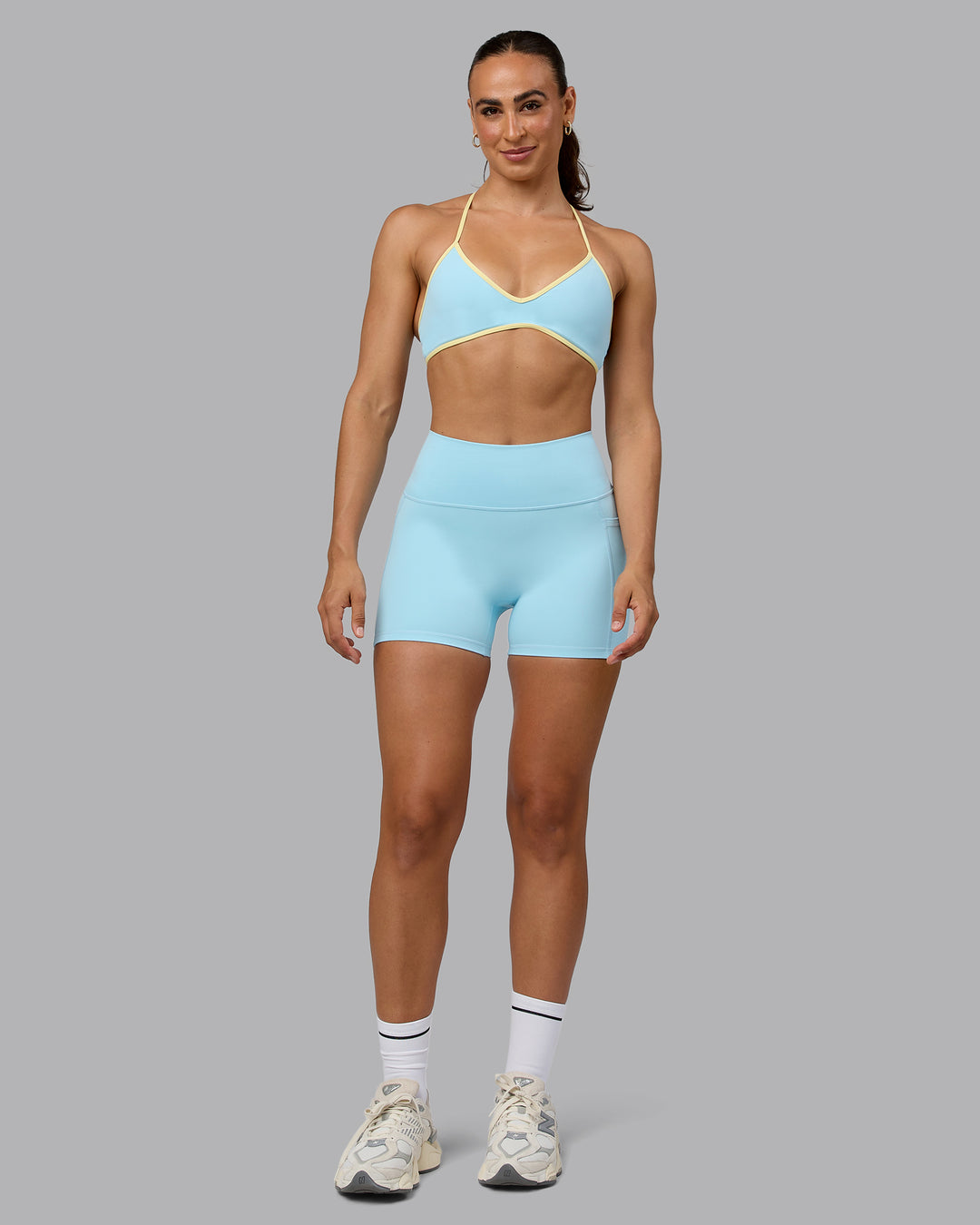 Woman wearing Ambience Sports Bra - Crystal Blue-Lemon