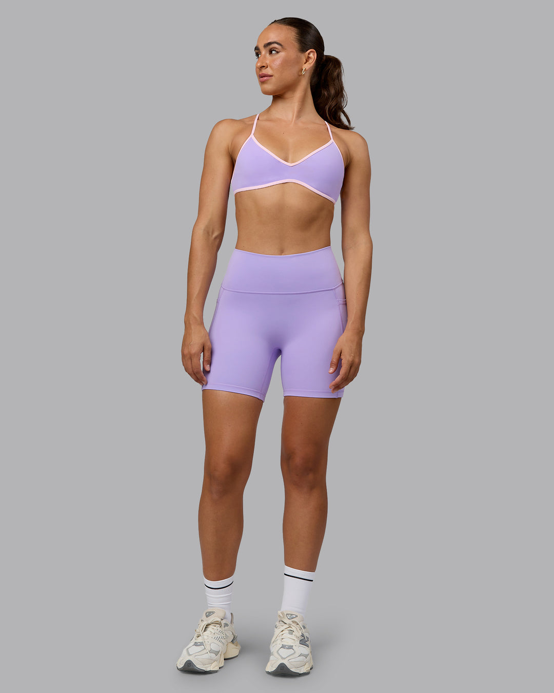 Woman wearing Ambience Sports Bra - Pale Lilac-Pale Pink