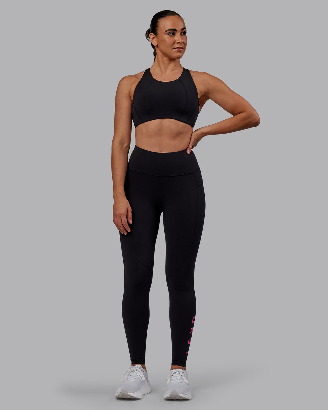 Woman wearing Ascent Sports Bra - Black