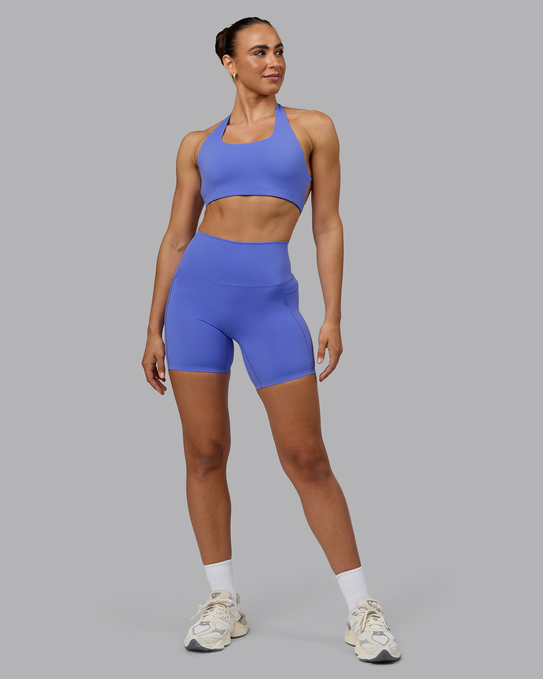 Woman wearing Aspire Sports Bra - Baja Blue