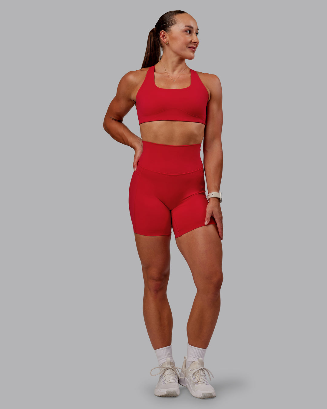 Woman wearing Aspire Sports Bra in Flame | Size:S