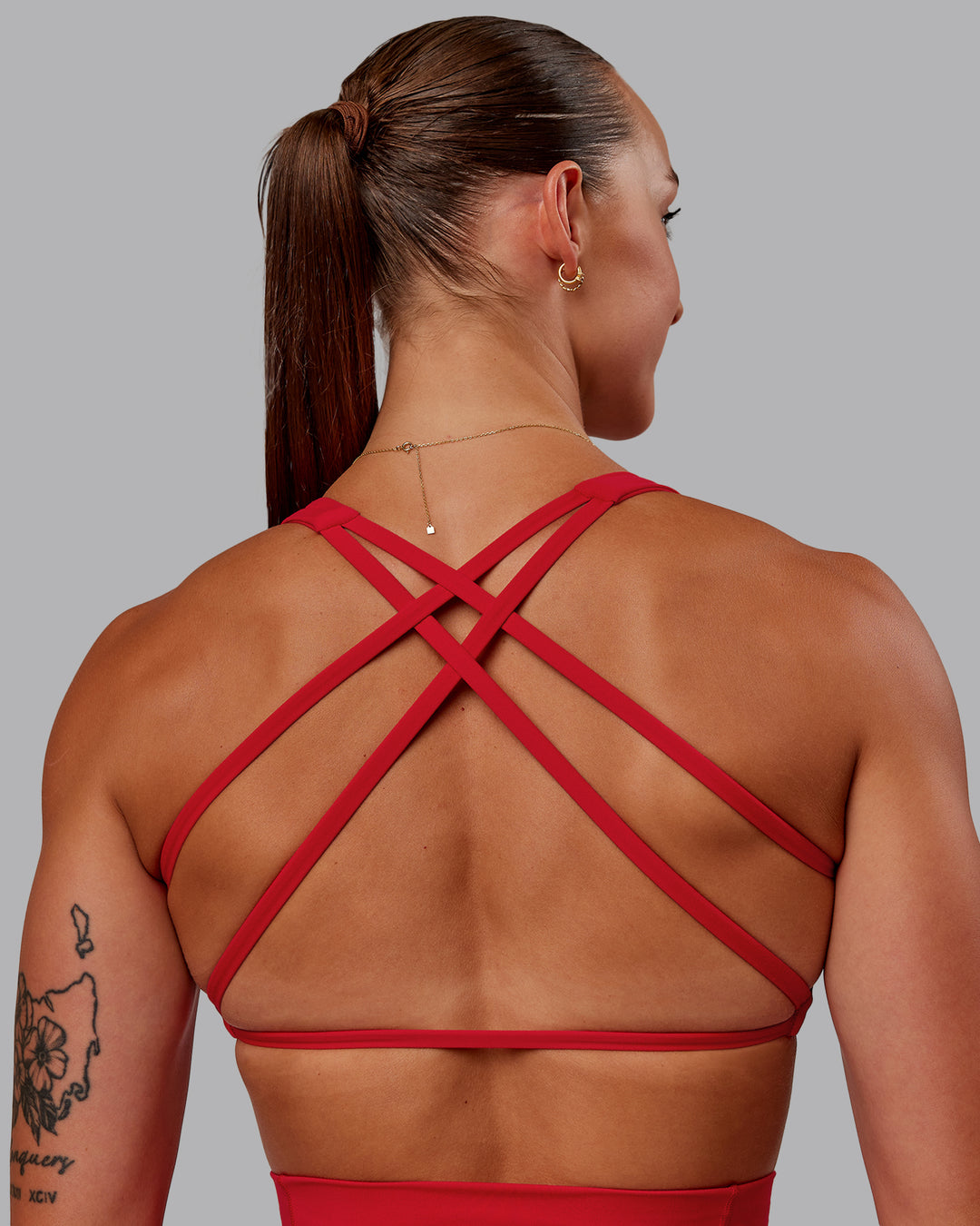 Woman wearing Aspire Sports Bra in Flame | Size:S