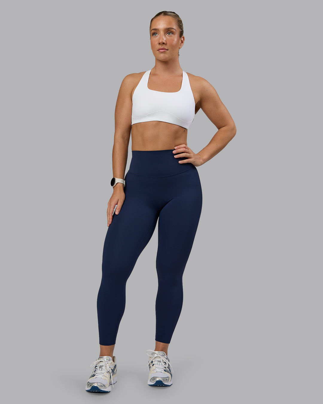 Woman wearing Aspire Sports Bra - White