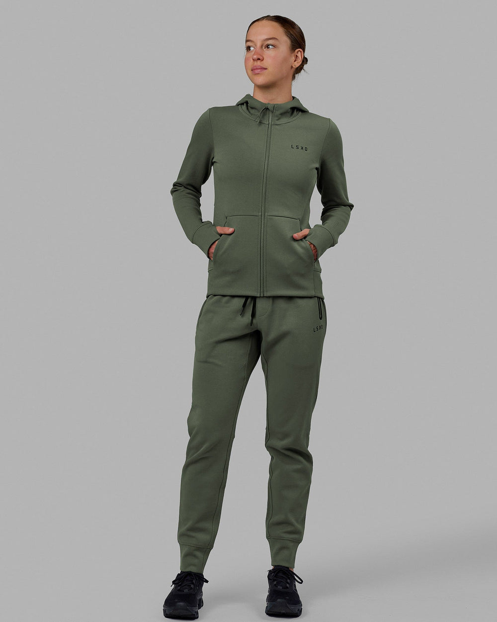 Woman wearing Womens Athlete ForgedFleece Track Pants - Dark Forest