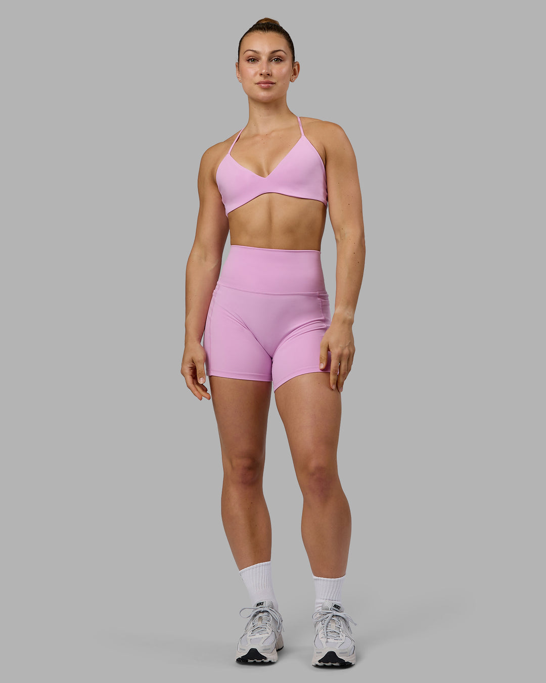 Woman wearing Aura Sports Bra - Pastel Orchid