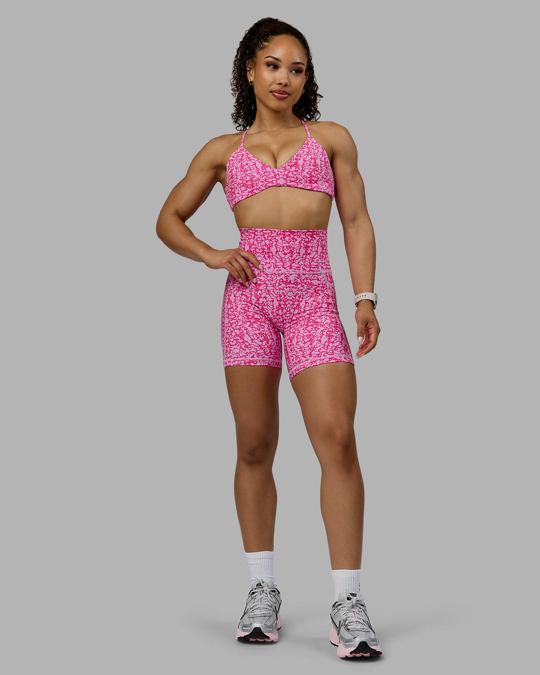 Woman wearing Aura Sports Bra - Patina-Ultra Pink