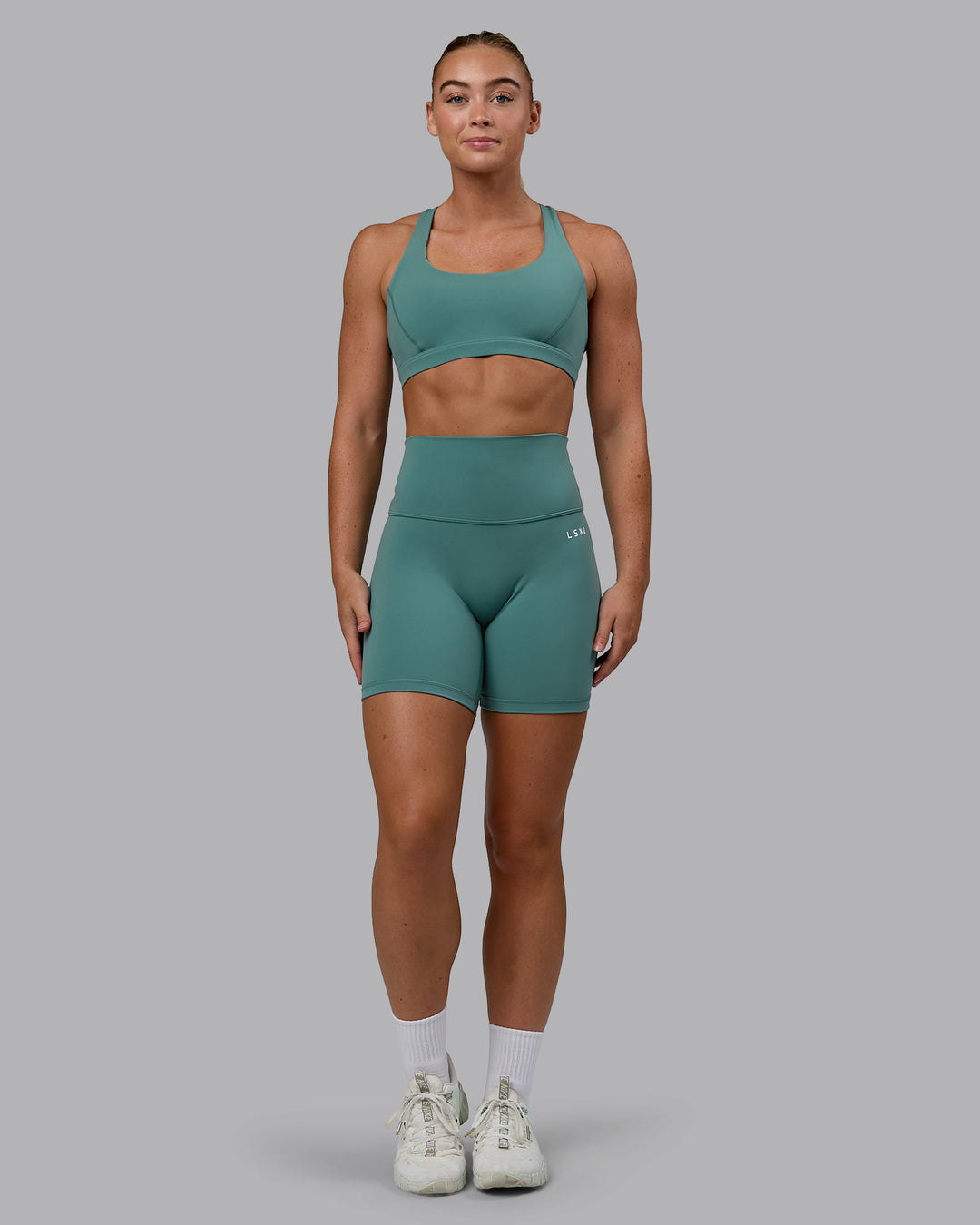 Woman wearing Base 2.0 Mid Short Tights - Sagebrush