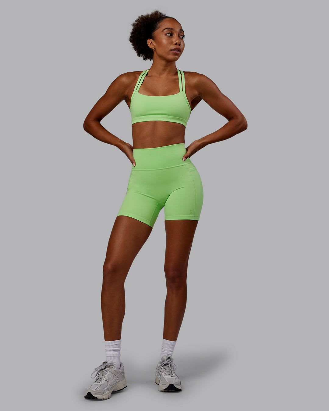 Woman wearing Bree Masters Fusion Mid Short Tights with Pockets - Pastel Lime