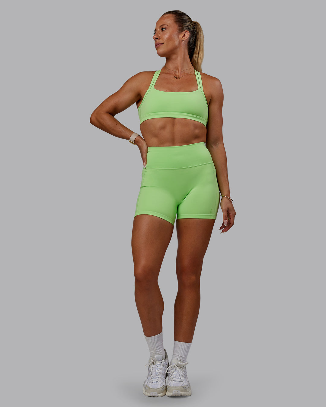 Woman wearing Bree Masters Fusion X-Short Tights with Pockets - Pastel Lime