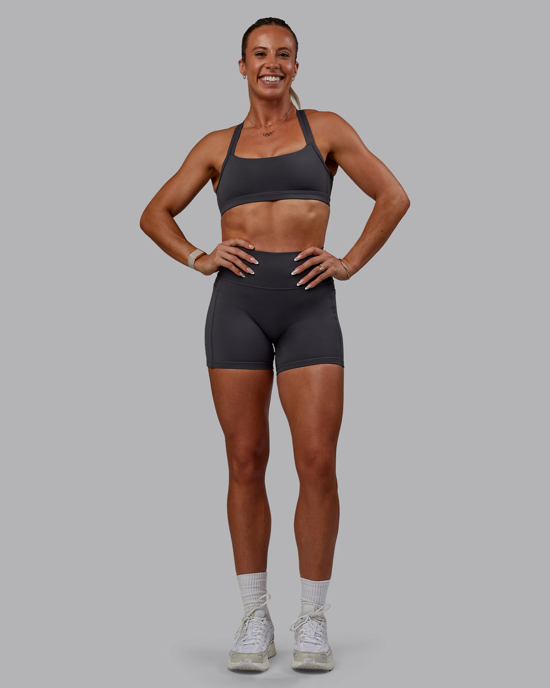 Woman wearing Bree Masters Velocity Sports Bra - Stormy