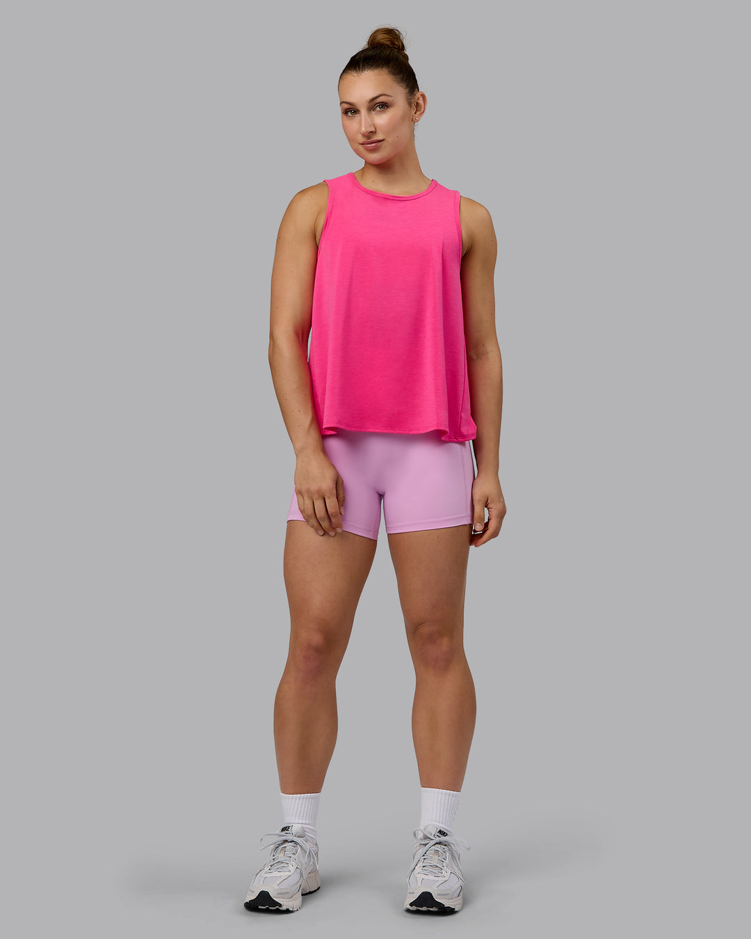 Woman wearing Breeze Training Tank - Ultra Pink