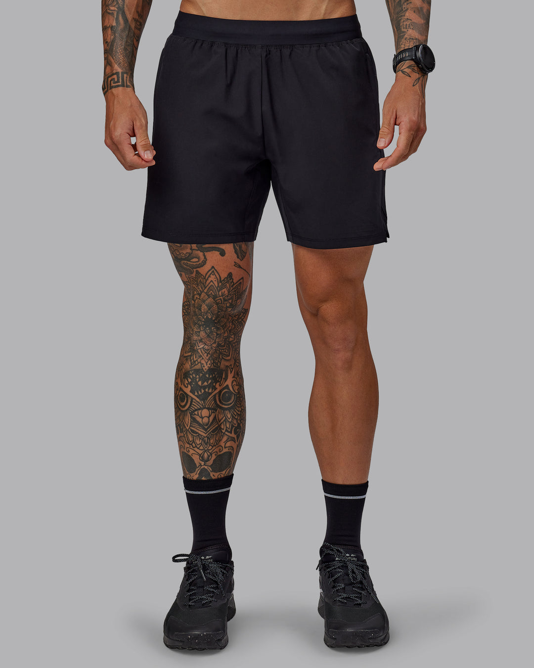 Man wearing Challenger 6" Performance Shorts in Black | Size:S