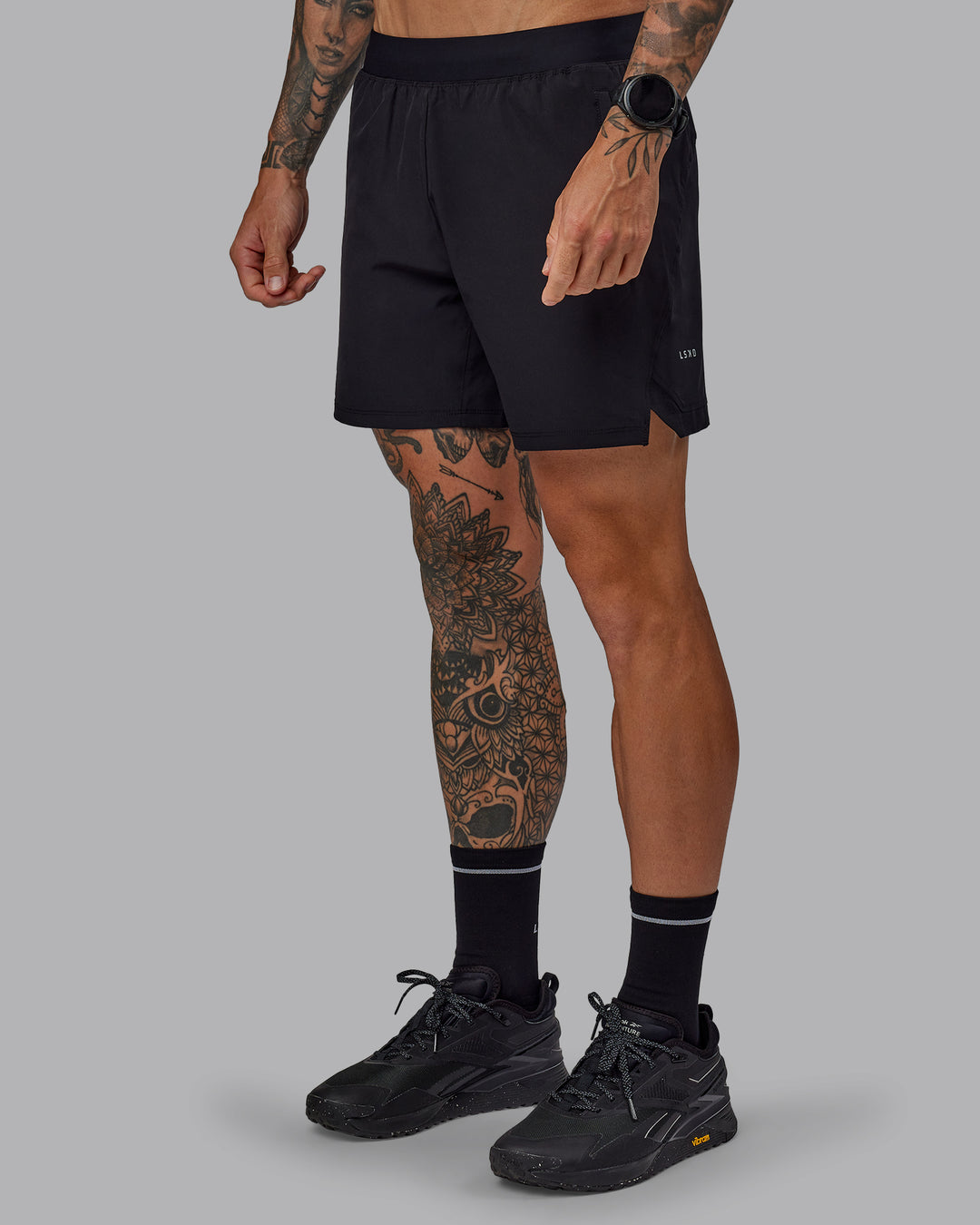 Man wearing Challenger 6&quot; Performance Shorts in Black | Size:S