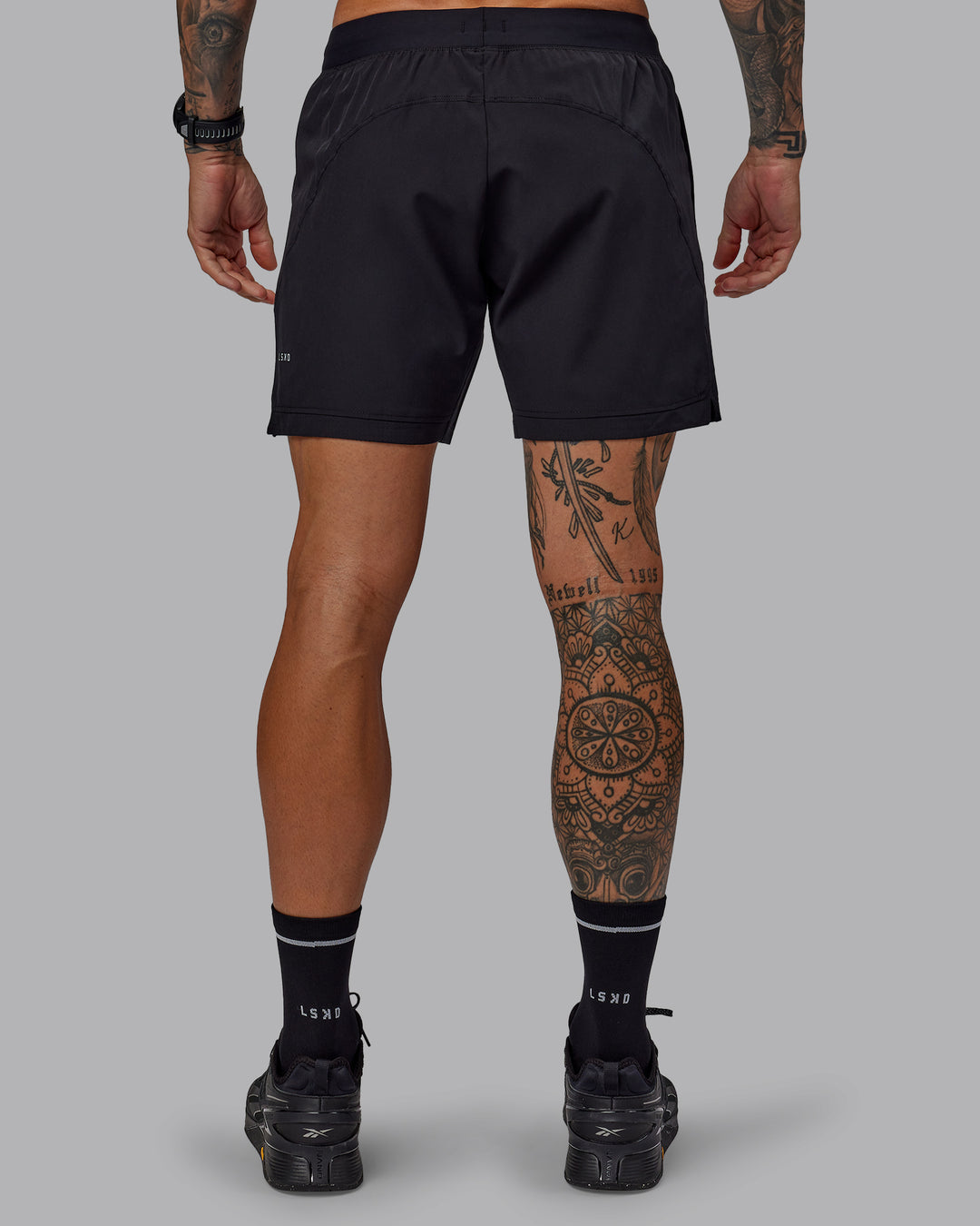 Man wearing Challenger 6&quot; Performance Shorts in Black | Size:S