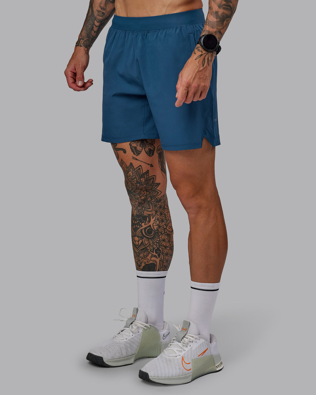 Man wearing Challenger 6&quot; Performance Short in Indigo | Size:S