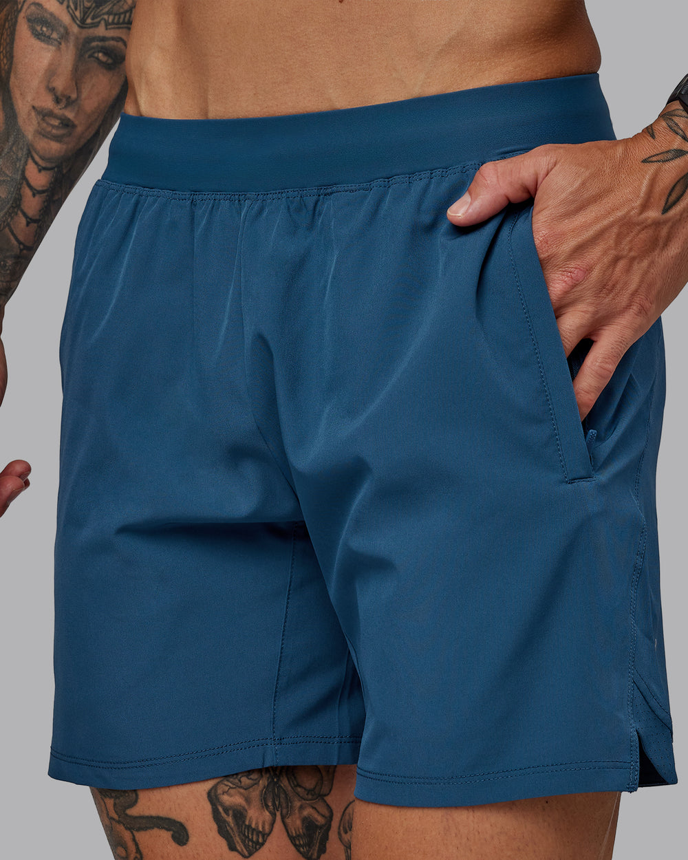 Man wearing Challenger 6" Performance Short in Indigo | Size:S