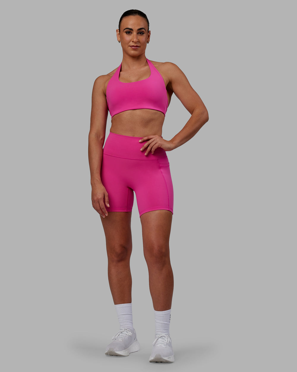 Woman wearing Challenger Sports Bra - Fuchsia Pink