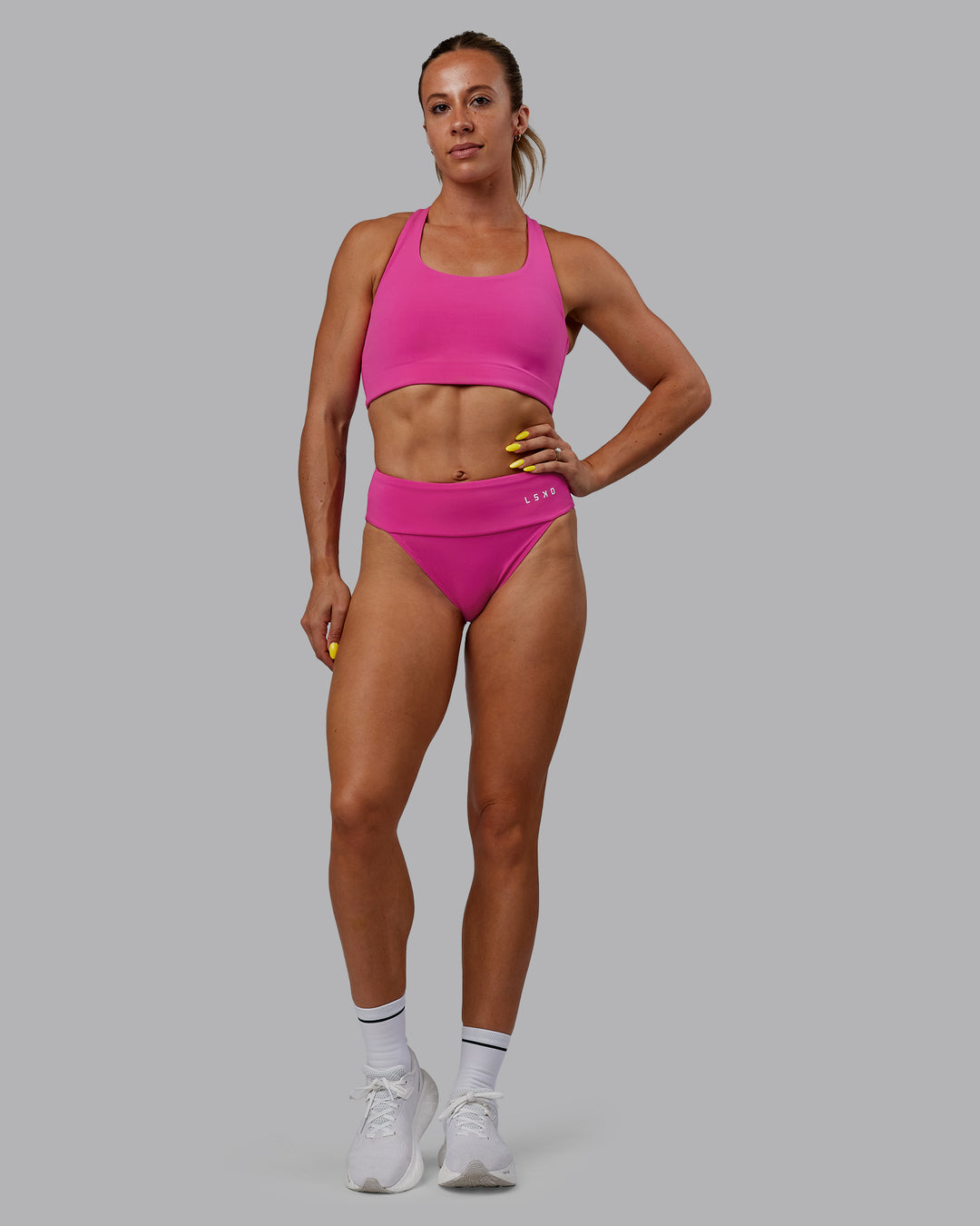 Woman wearing Elevate Sprinting Briefs - Fuchsia Pink