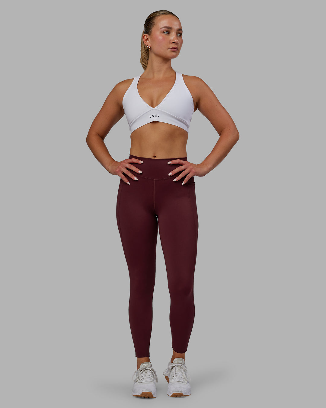 Woman wearing Elite 7/8 Length Leggings - Dark Cherry