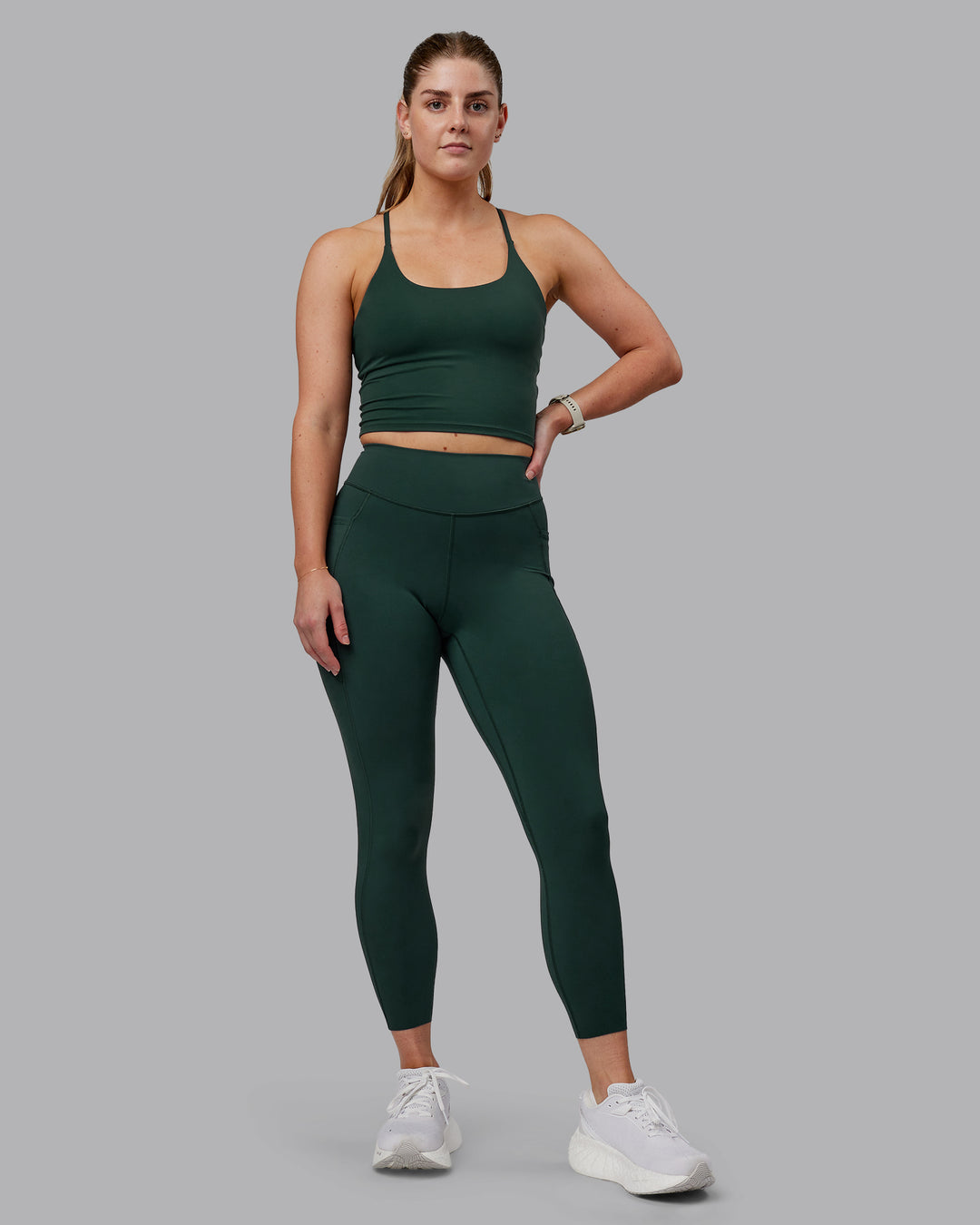 Woman wearing Elite 7/8 Length Leggings - Vital Green