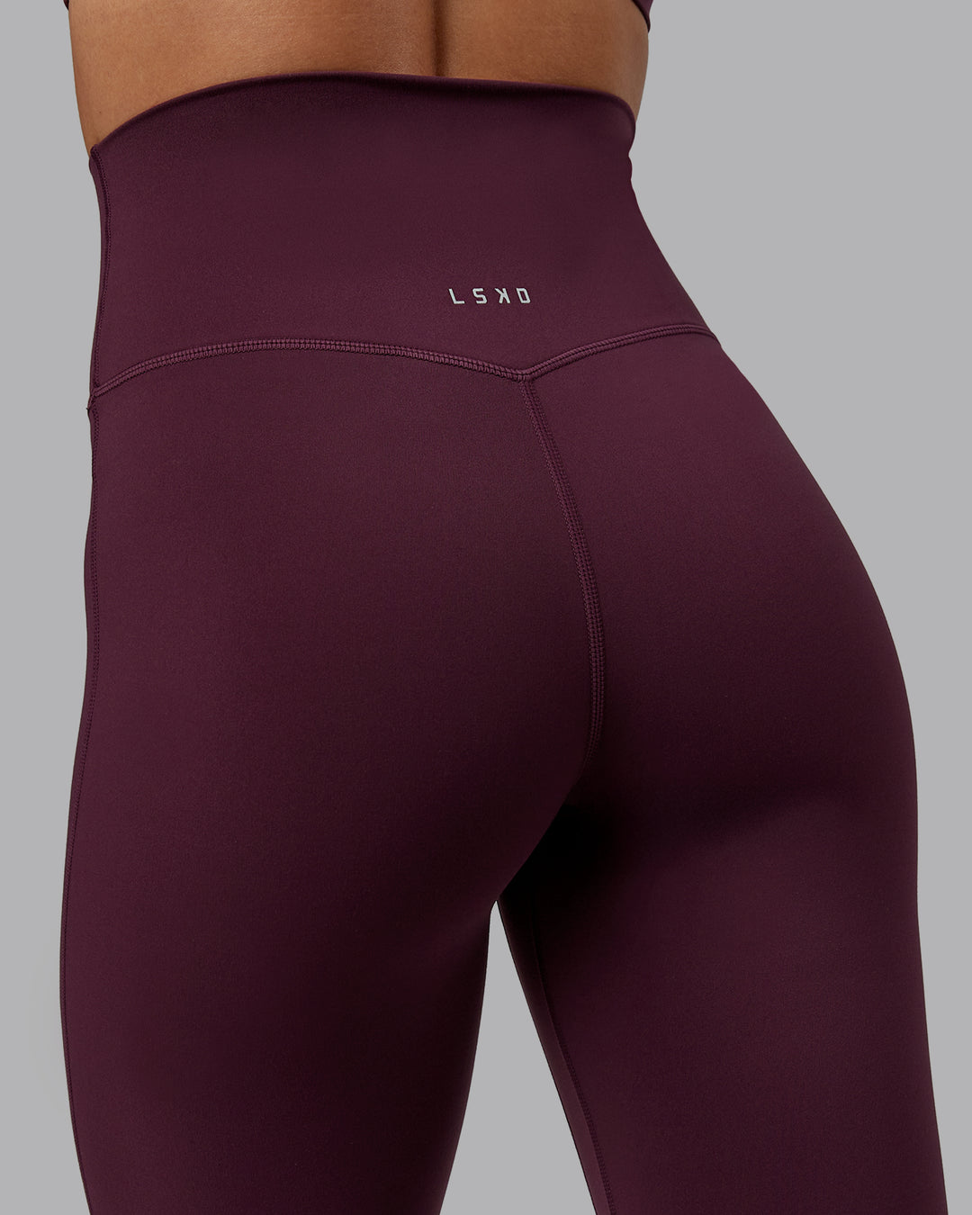 Woman wearing Elixir Full Length Tight in Cherry Lacquer | Size:S