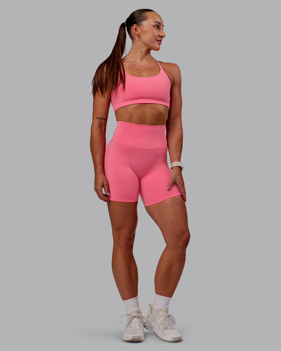 Woman wearing Elixir Mid Short Tight in Pink Lemonade | Size:S